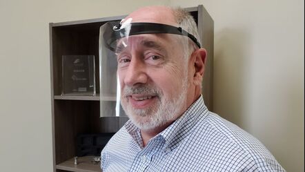 Mike Mowins, President of Vetted Tech, models one of the newly created face shields
